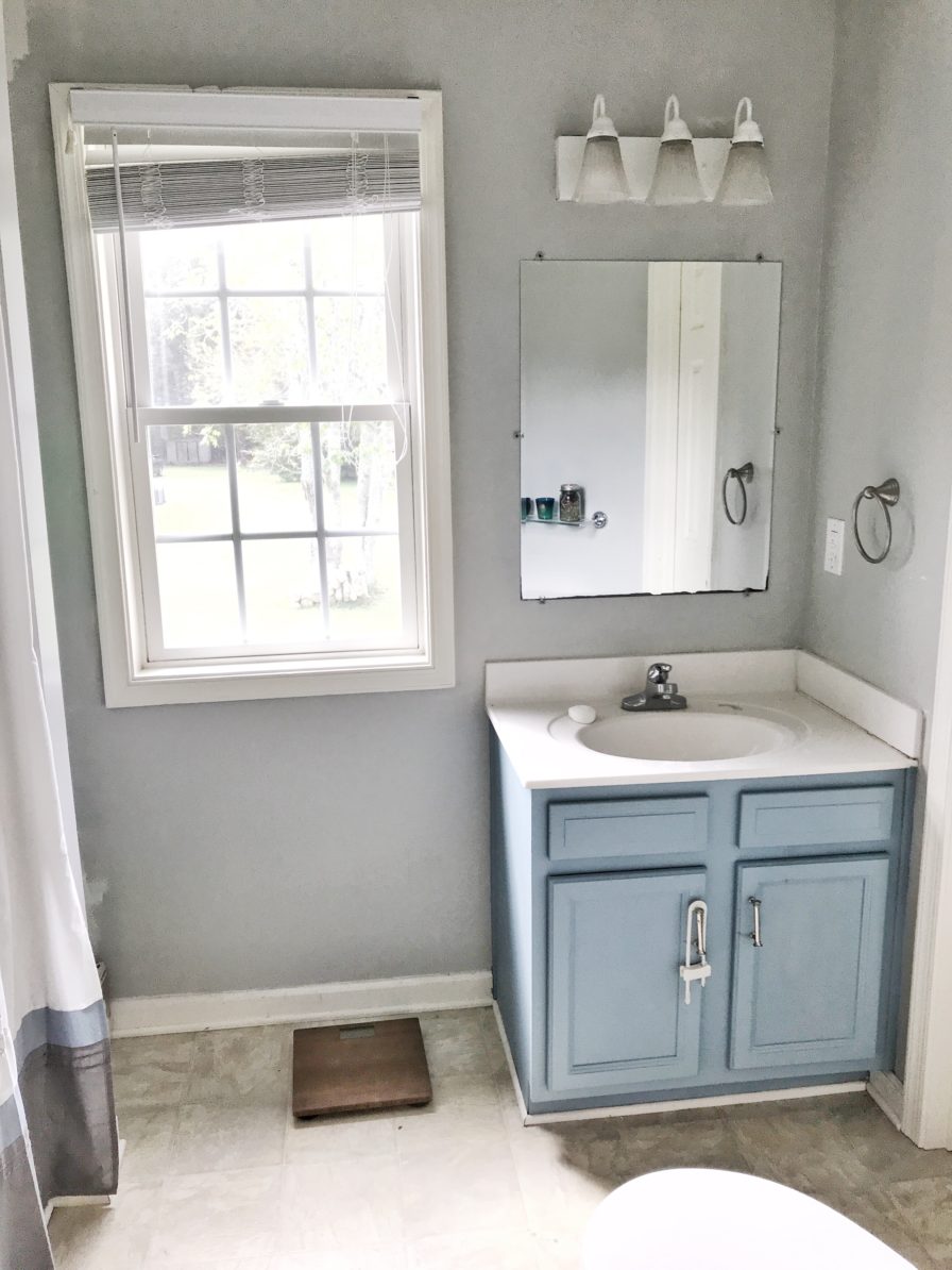 Modern Navy and White Bathroom Renovation including DIY painted vanity, painted vinyl floors and mixed metals from StampinFool.com