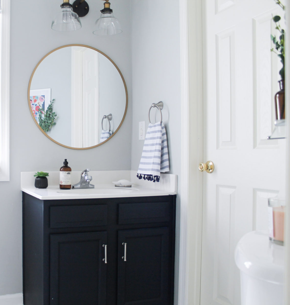 One Room Challenge: Guest Bath Reveal in Williamsburg, VA from StampinFool.com Modern Navy and White Bathroom Renovation including DIY painted vanity, painted vinyl floors and mixed metals from StampinFool.com