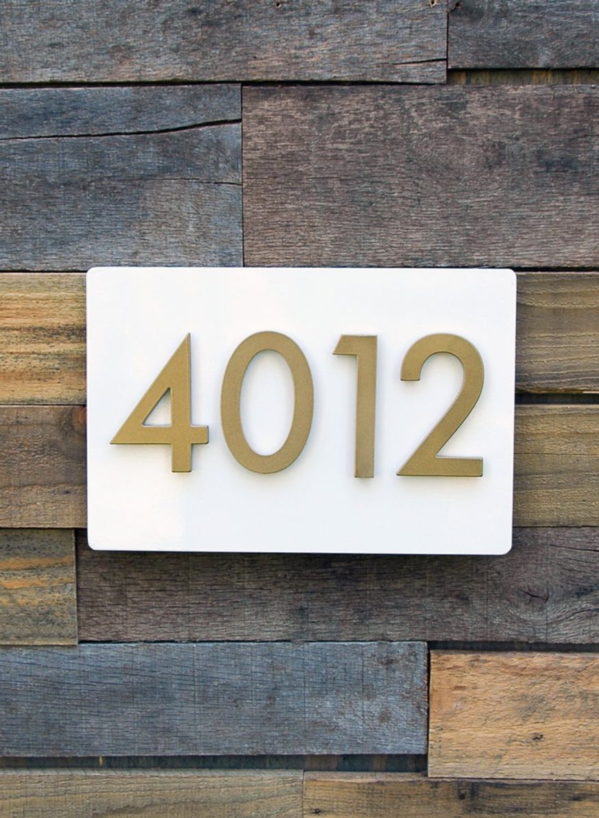 white plate with gold modern house numbers 