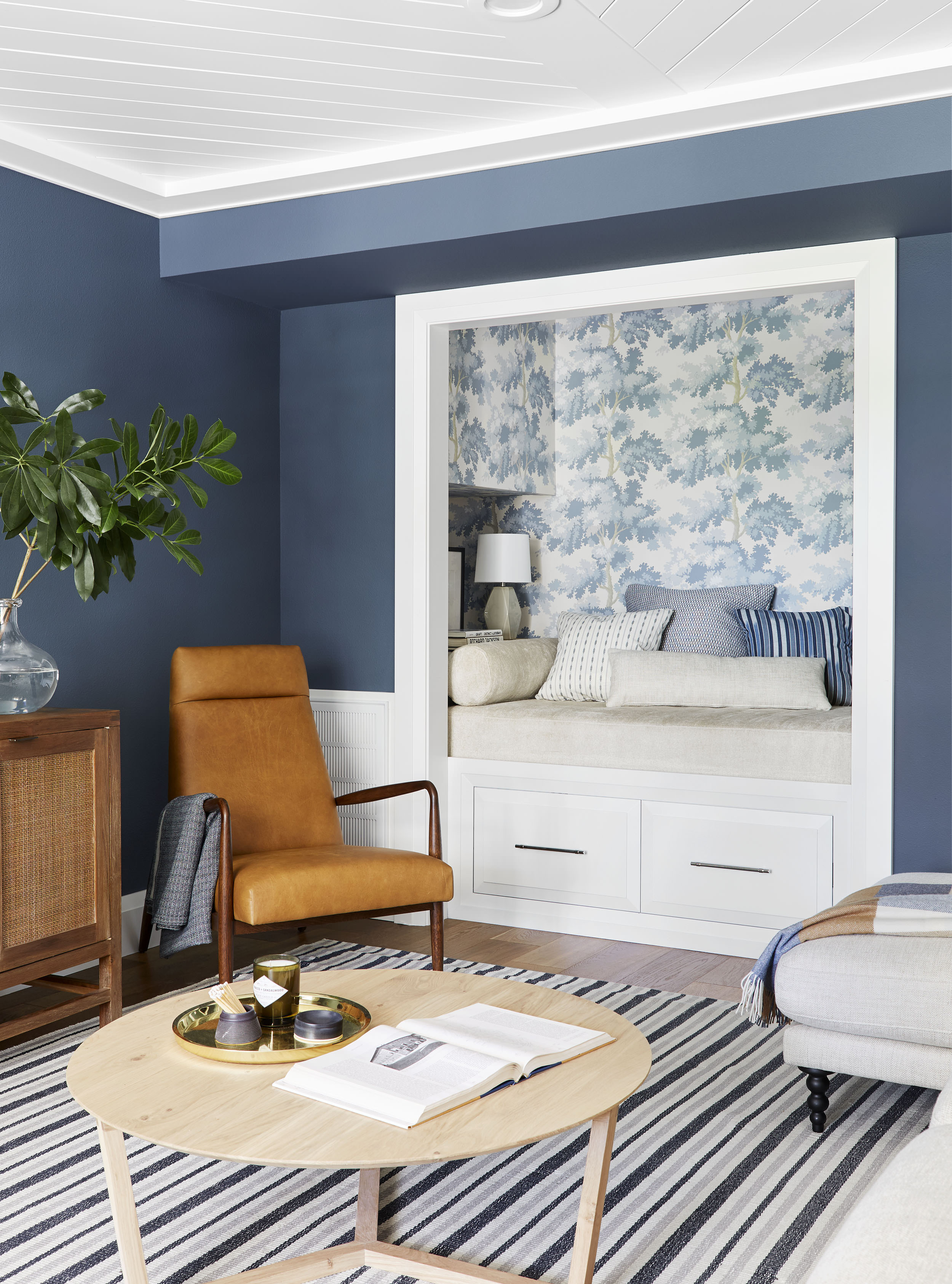 Sherwin Williams Waterloo adorns the walls of this living room 