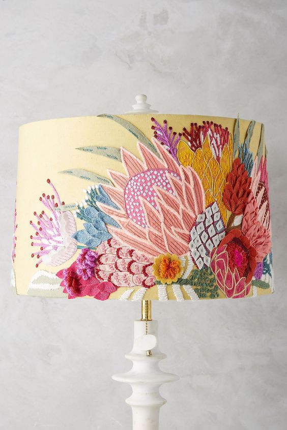 A proper fitting lamp shade should show a little bit of neck, but not too much. Use color and pattern in the shade to make the room vibrant.