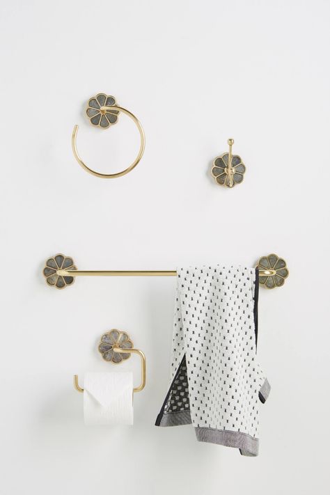 Anthropologie has gorgeous bath towel hooks and towel bars to level up your bathroom decor/