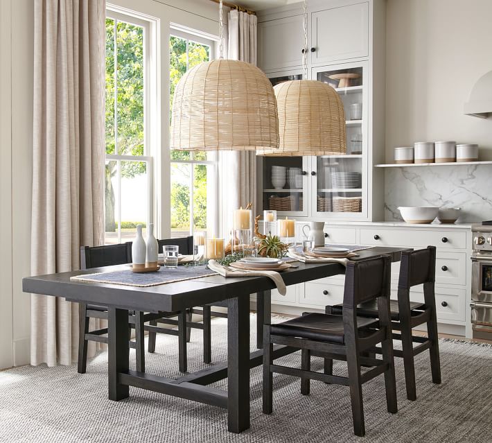 Large woven lights over an eat in kitchen