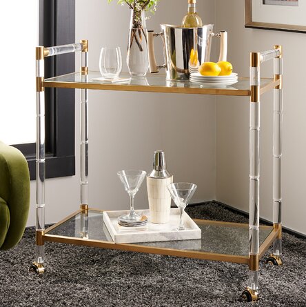 gold and lucite bar cart