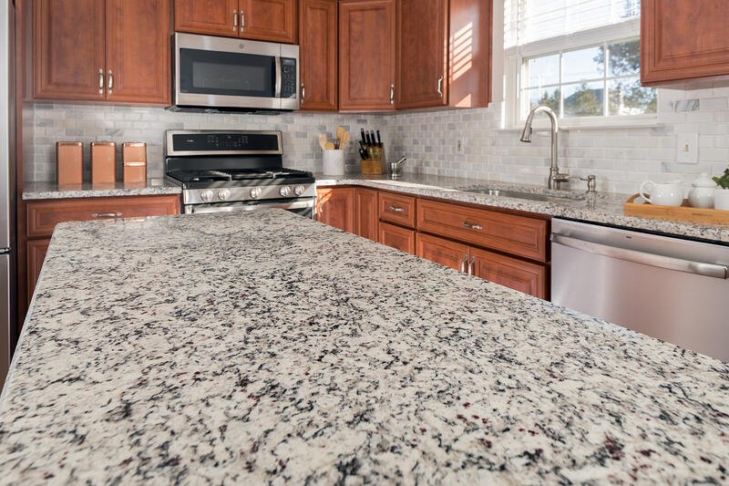 Are granite countertops outdated? YES. Outdated Decorating Trends: Granite Countertops.
Instead check out what material we are using. 