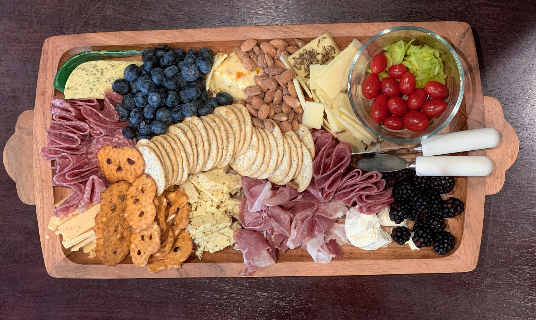 How to Make a Cheeseboard for a Fall Dinner Party, example of cheese board with ingredients from Trader Joe's