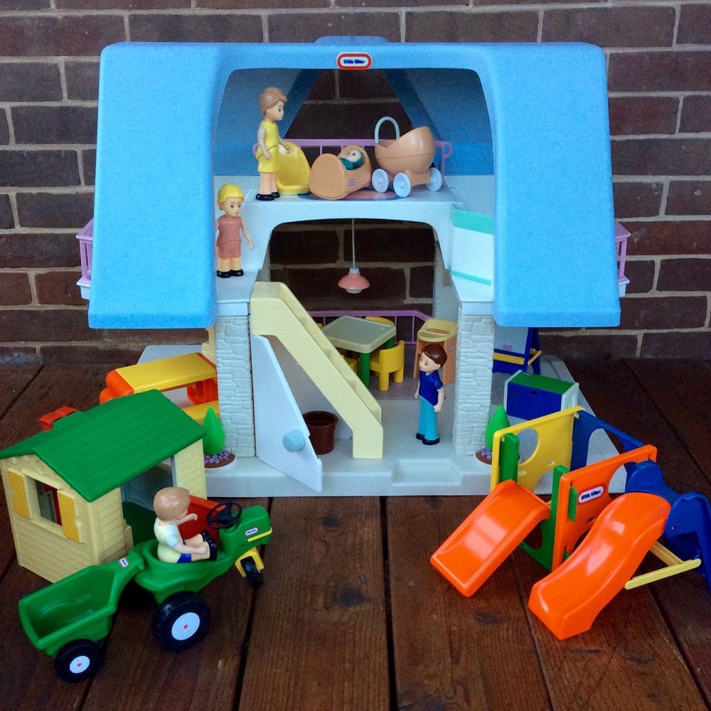 1990's Little Tikes plastic dollhouse with blue roof and pull out deck, including the people and yard accessories