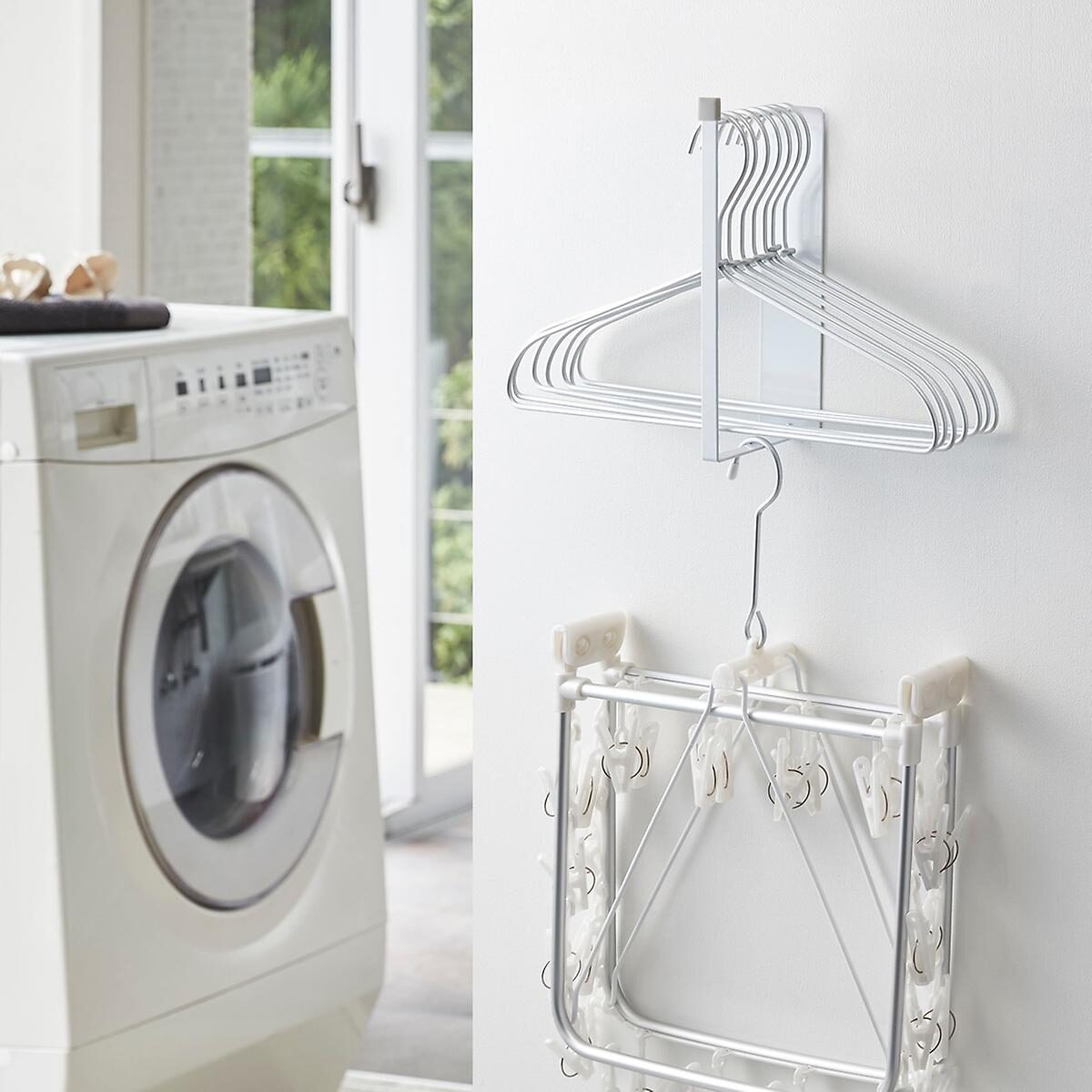 Laundry room shelf and rod storage solutions