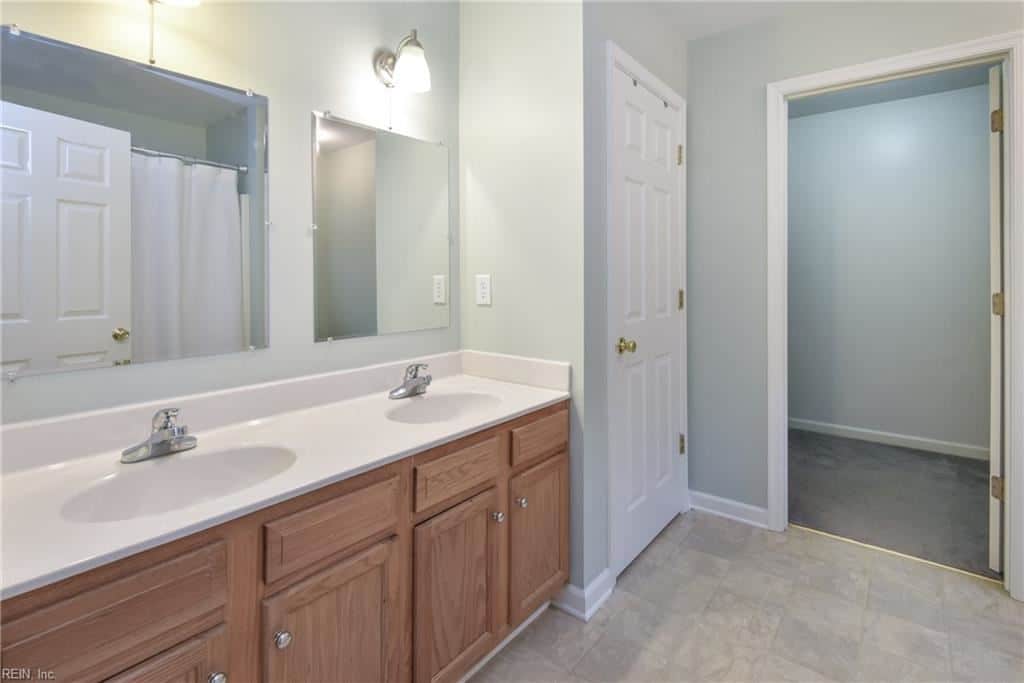 Sherwin Williams Sea Salt painted in a powder room with oak cabinets