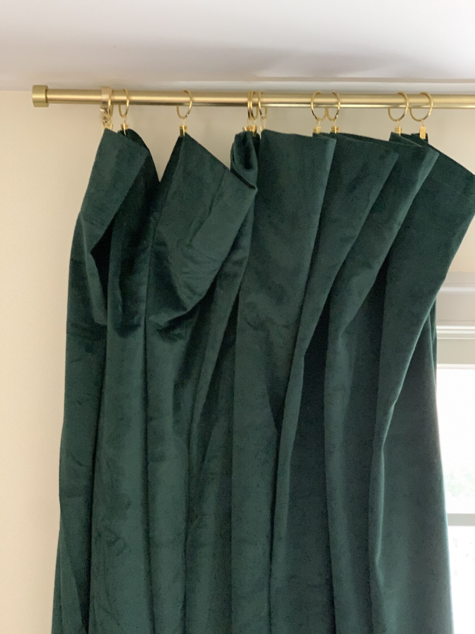 green velvet curtains with gold rings and clips