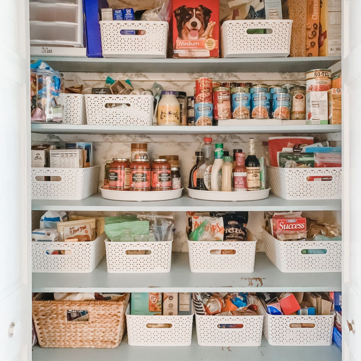 On the middle shelf are 2 15" lazy susans for jars and bottles of pantry items.